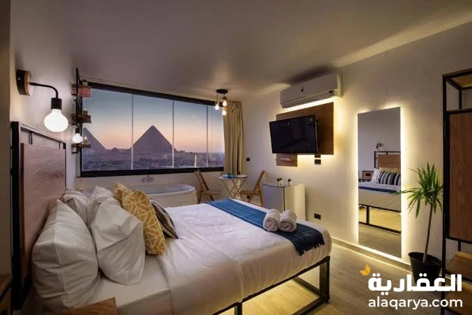 شقه للبيع فيو الاهرامات ١٨٦م في كمبوند كامل الخدمات أمام كمبوند نيو جيزه